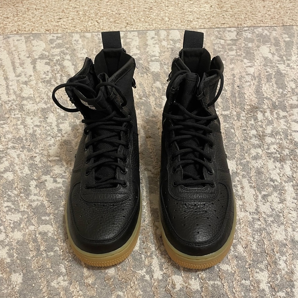 Black Air Force 1s high tops with bubble gum bottoms